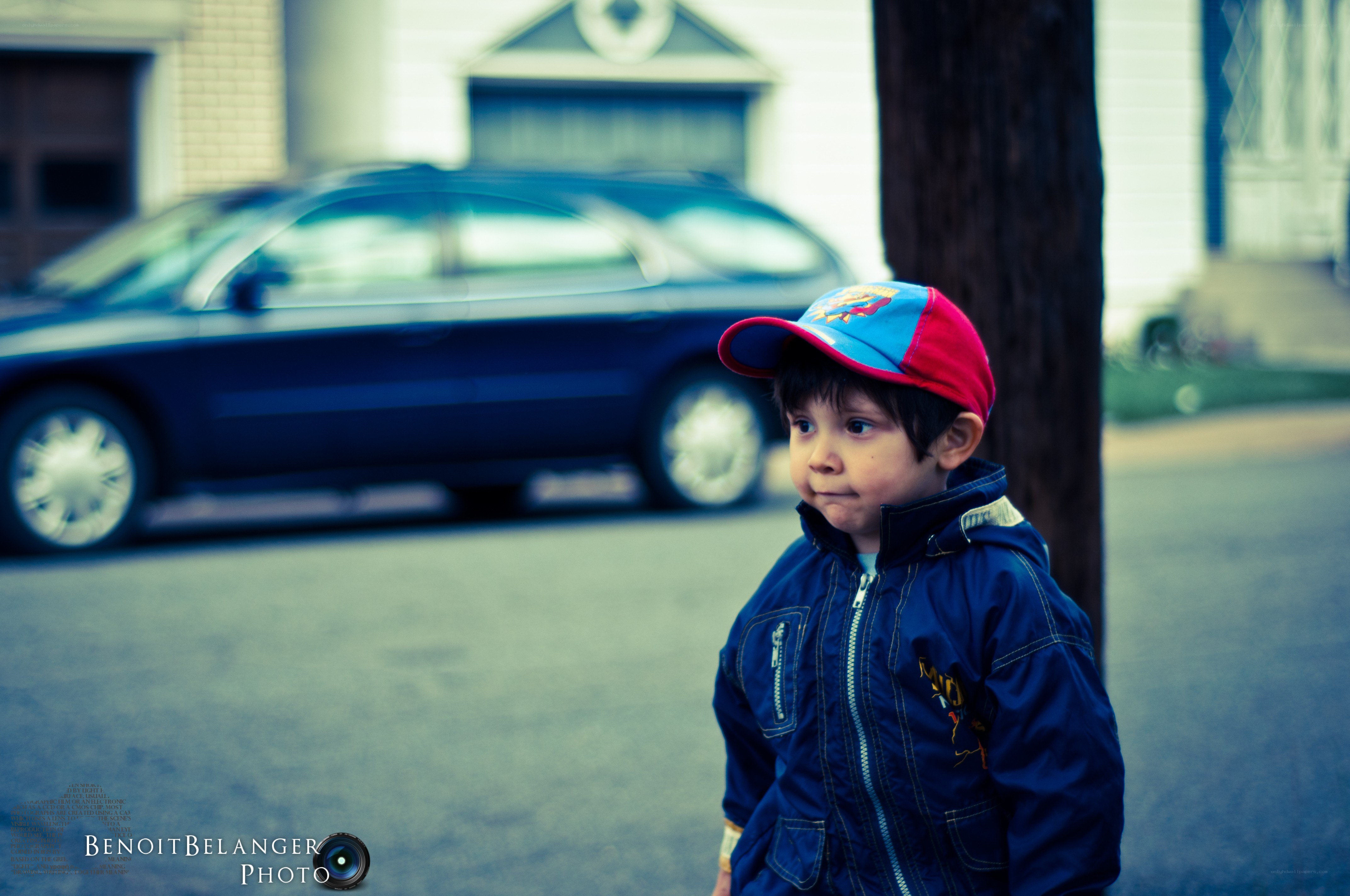 child in cap on street