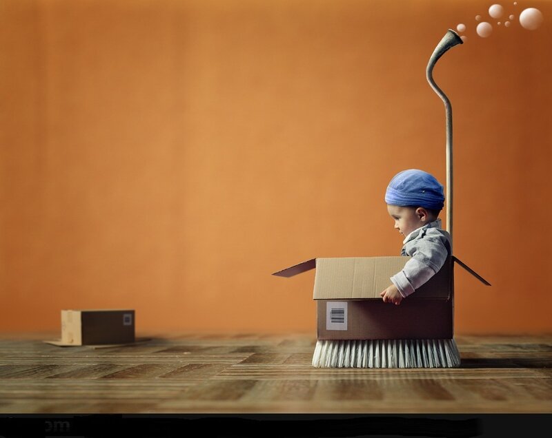 Child in Cardboard Box — Orange
