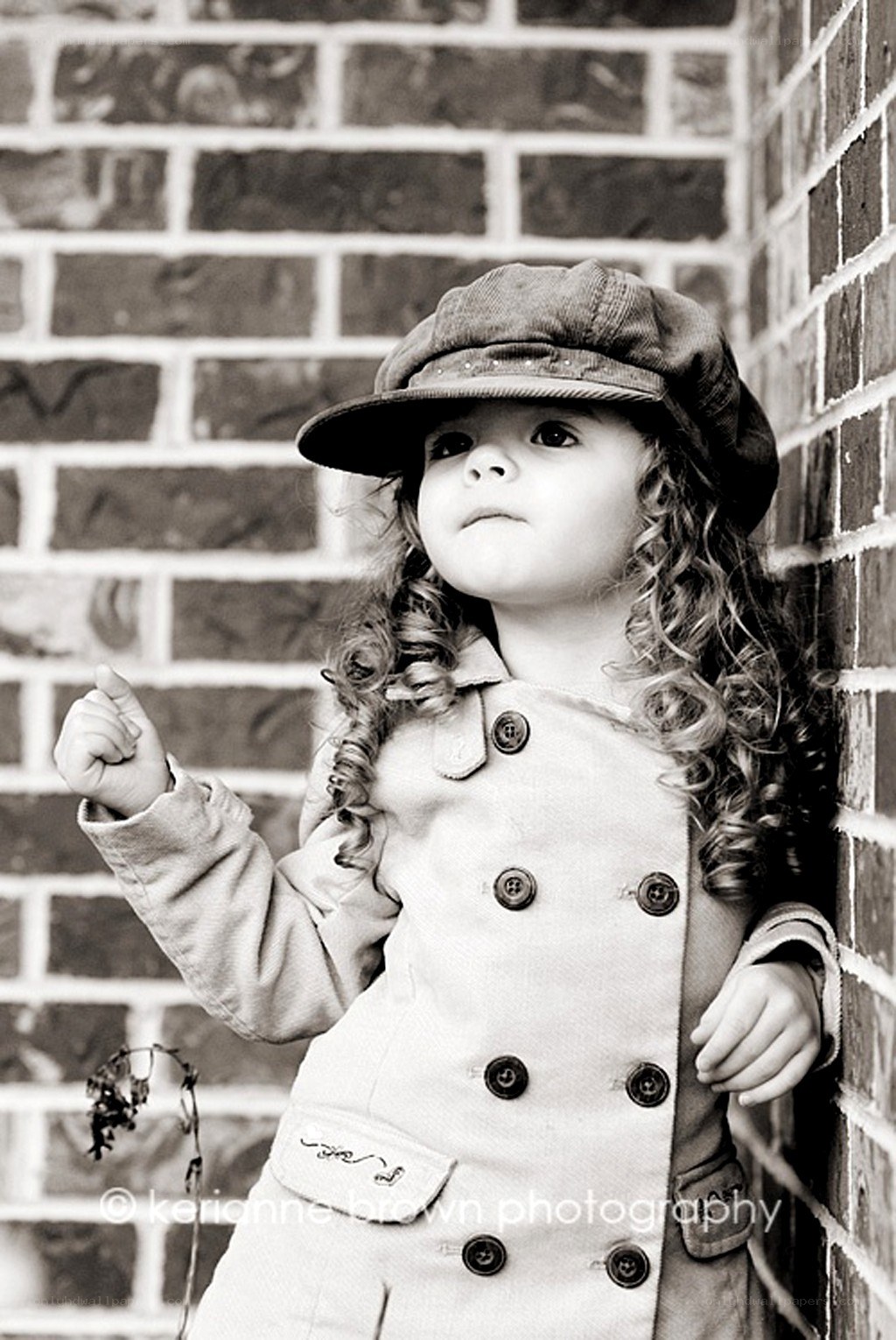 child in coat and cap