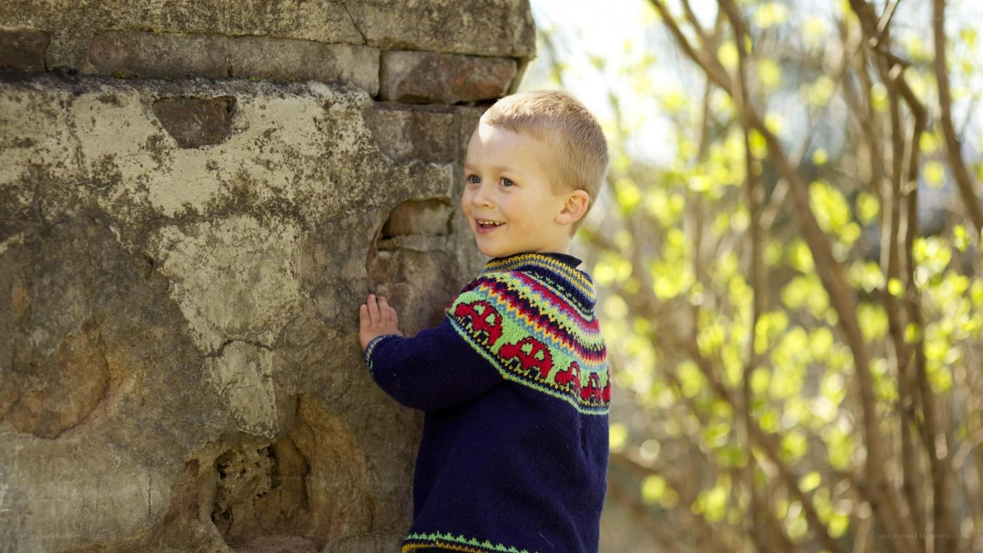 child in colorful sweater