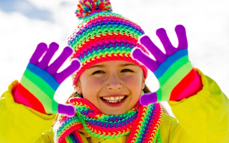 child in colorful winter gear