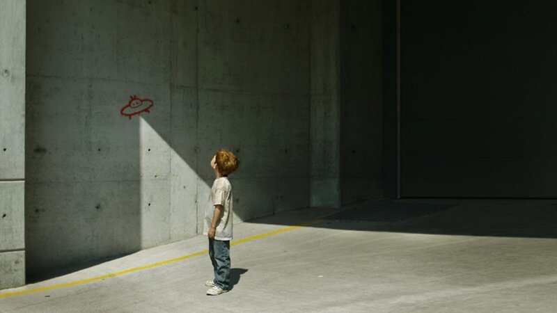 child in concrete alley