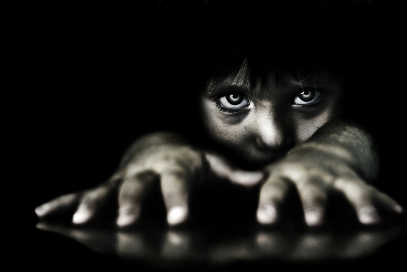 Child in Dark Room