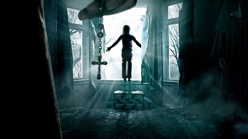 child in dark room with cross