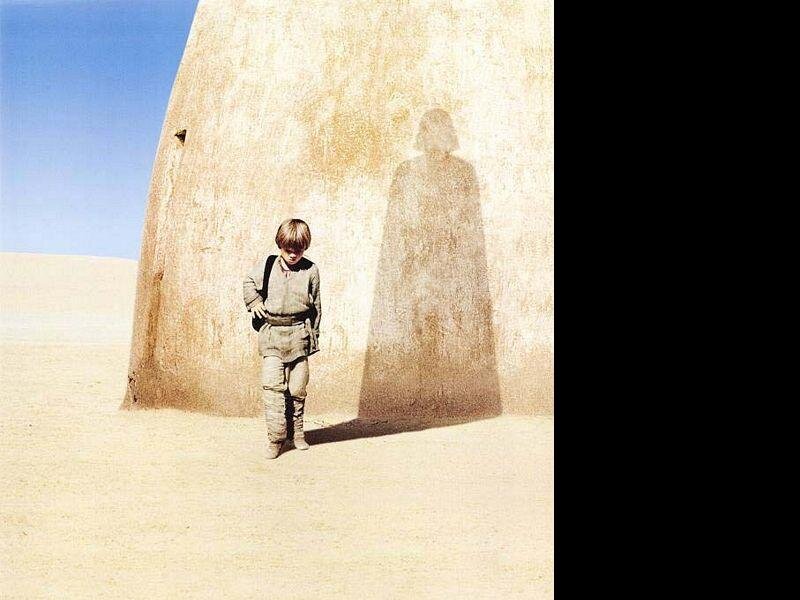 child in desert with shadow