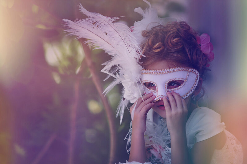 Child in Feathered Mask