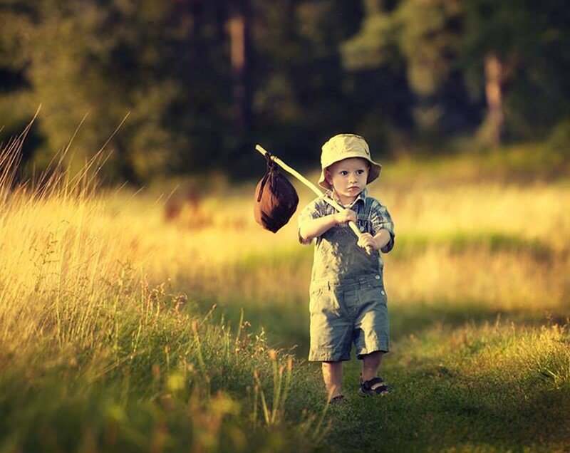 Child in Field — Green