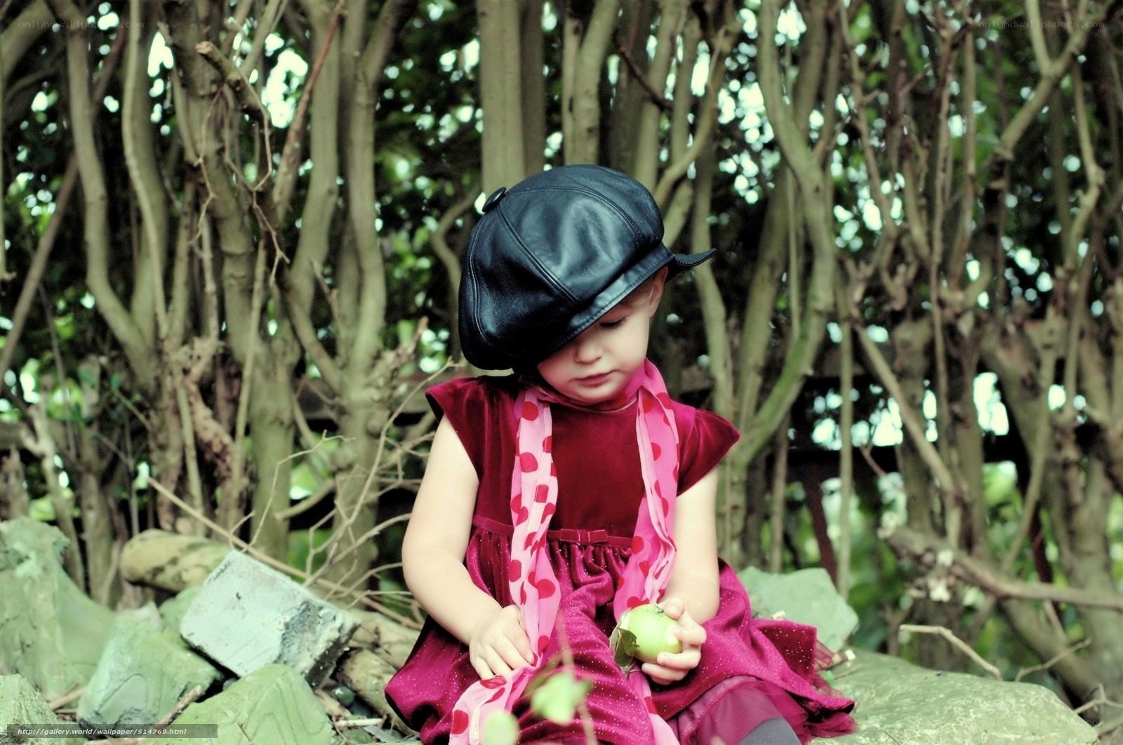 child in forest with apple