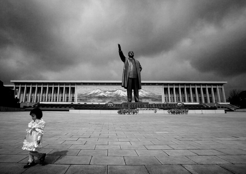 Child in front of statue