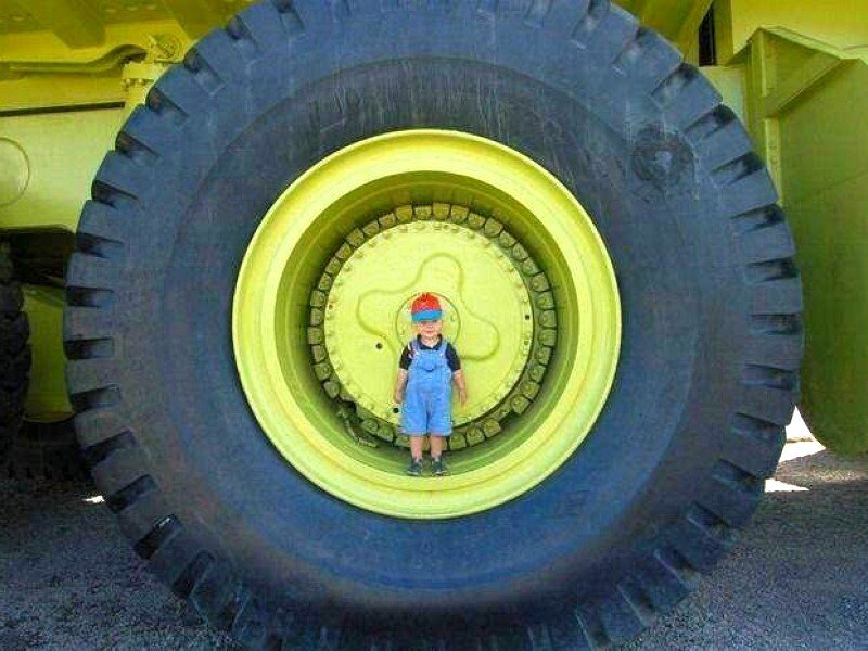 child in giant tire