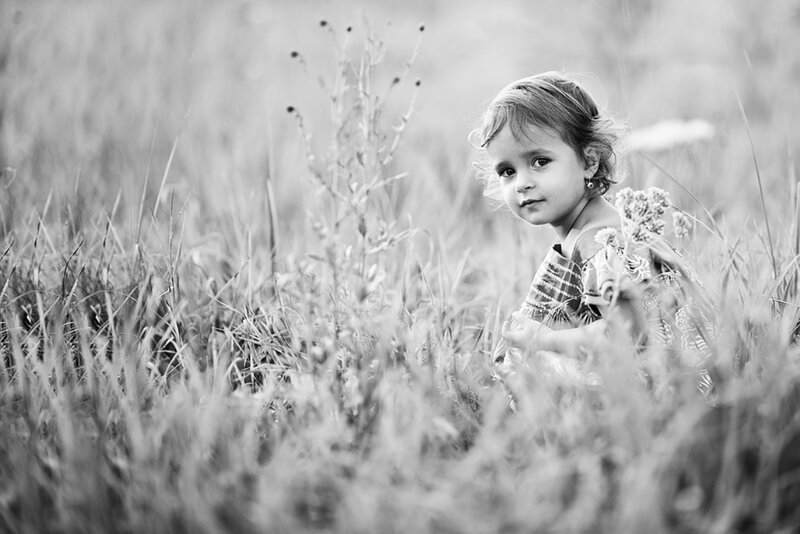 Child in Grass Field