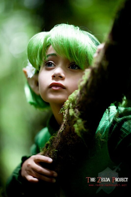 child in green costume