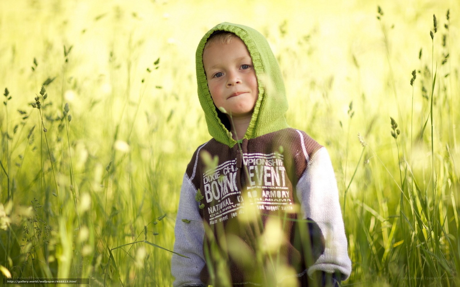 child in green hoodie
