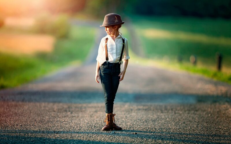 Child in Hat on Road