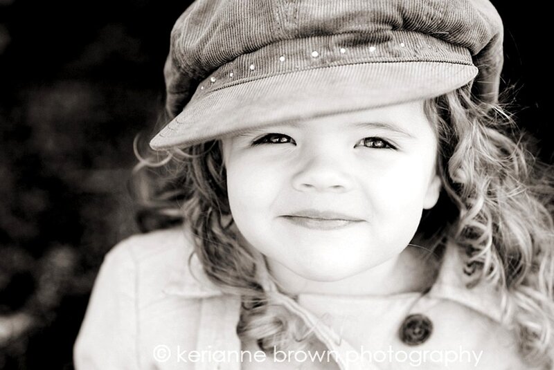 child in hat smiling