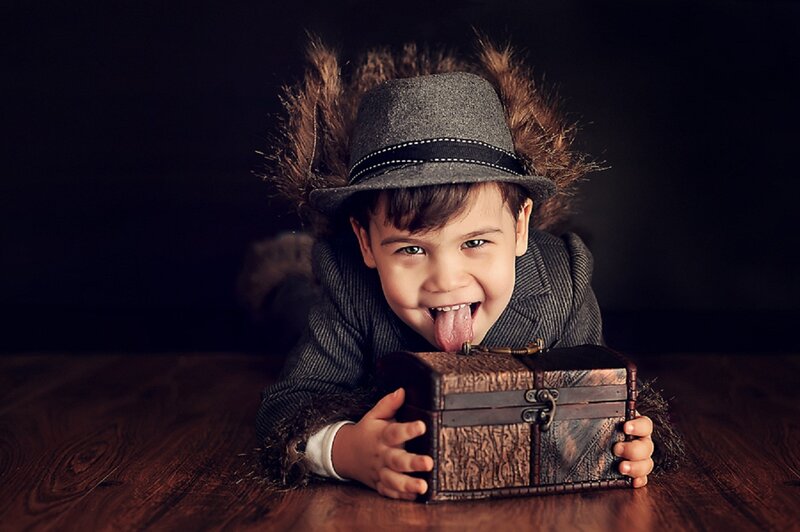 Child in Hat with Chest