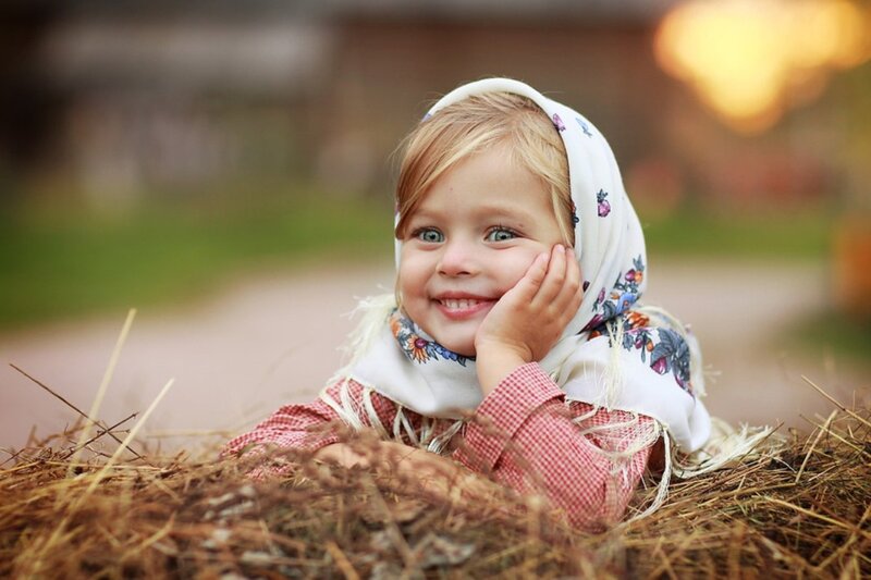 Child in Hay Bale