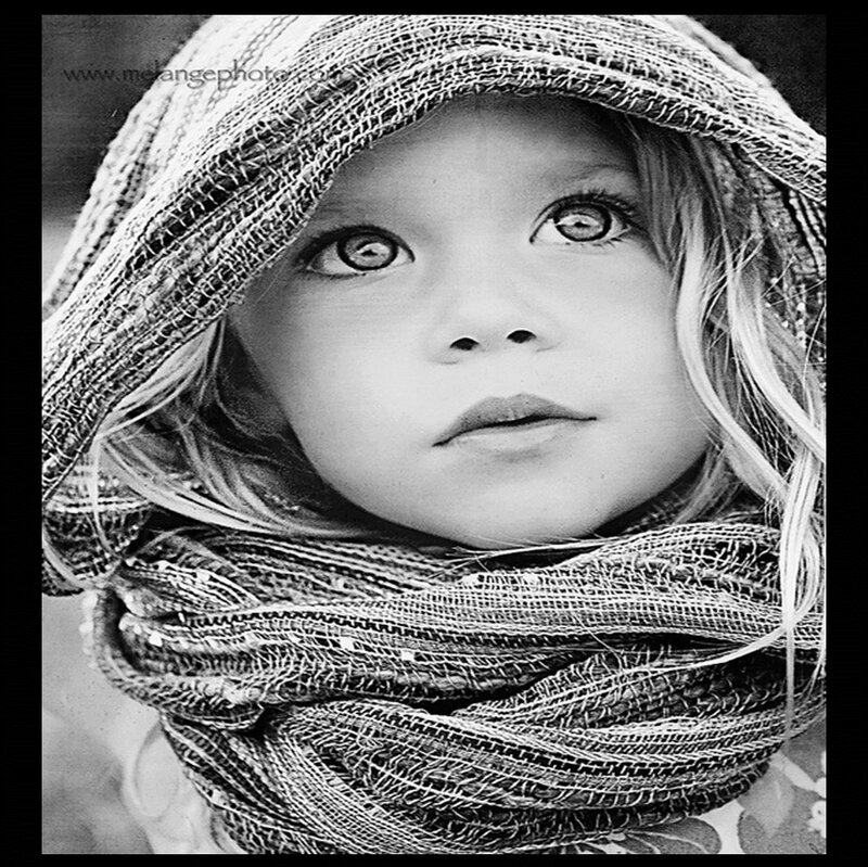 Child in Hooded Scarf