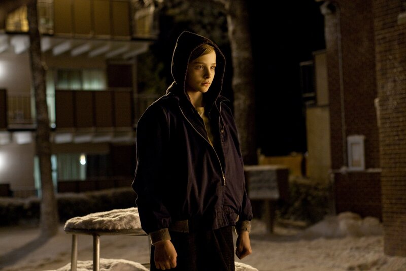 child in hoodie at night