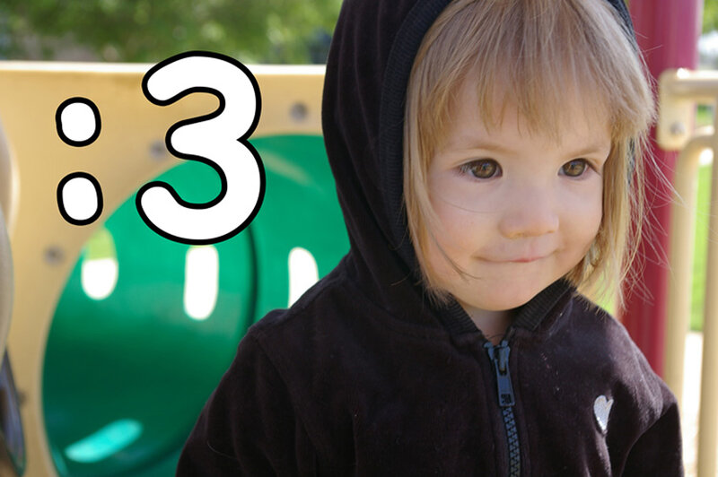 child in hoodie at playground