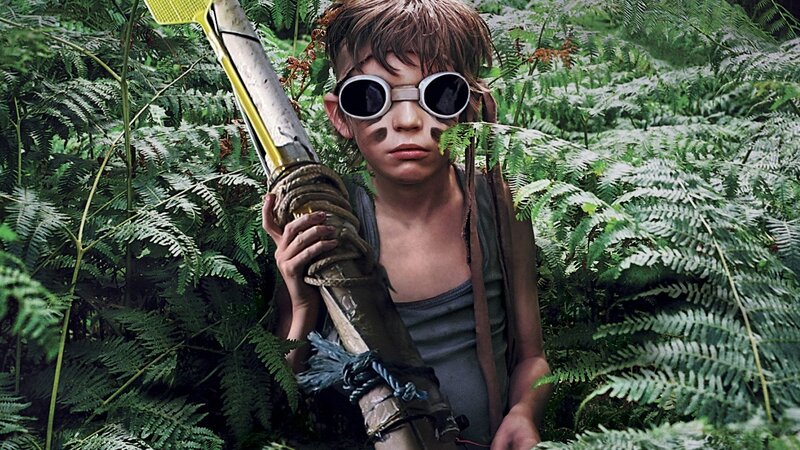 child in jungle with weapon