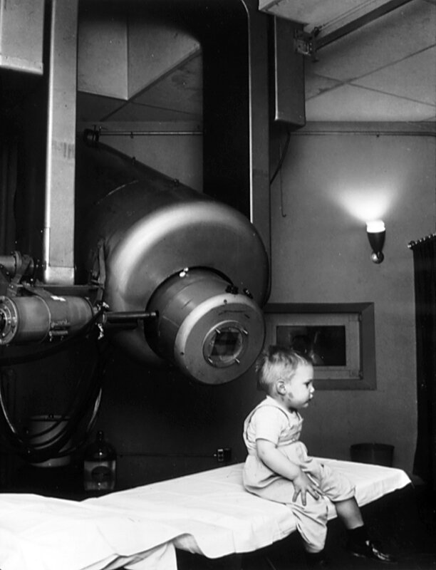 Child in medical room with equipment