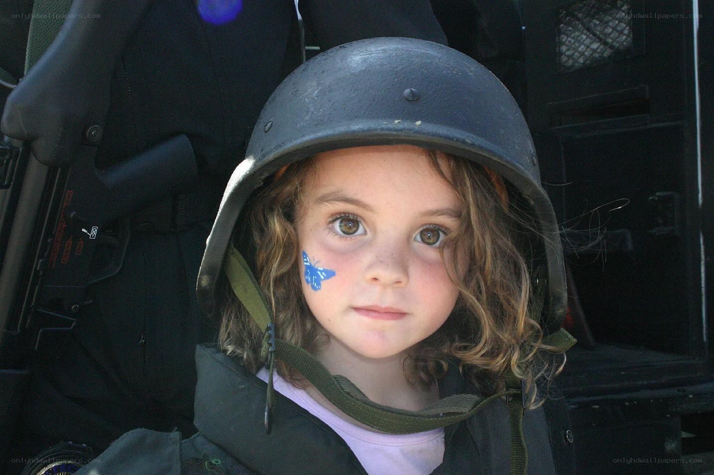 child in military helmet