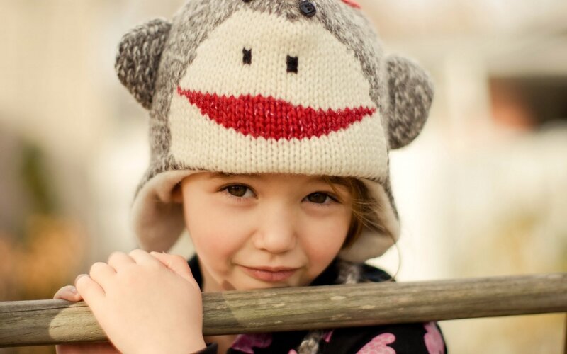 child in monkey hat