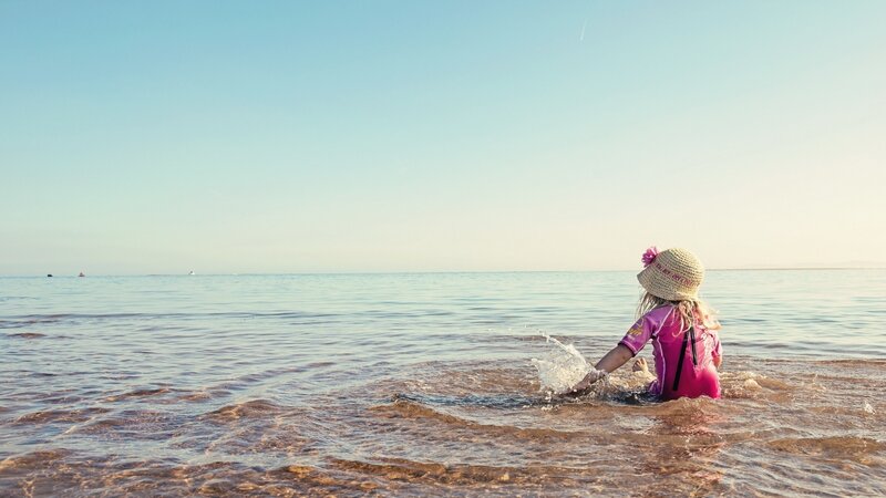 Child in Ocean Water — Blue