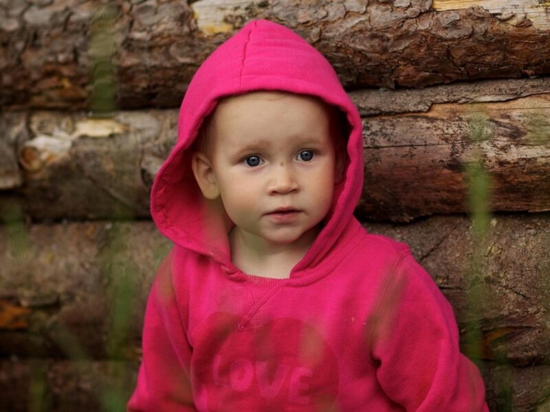 Child in Pink Hoodie — Neutral