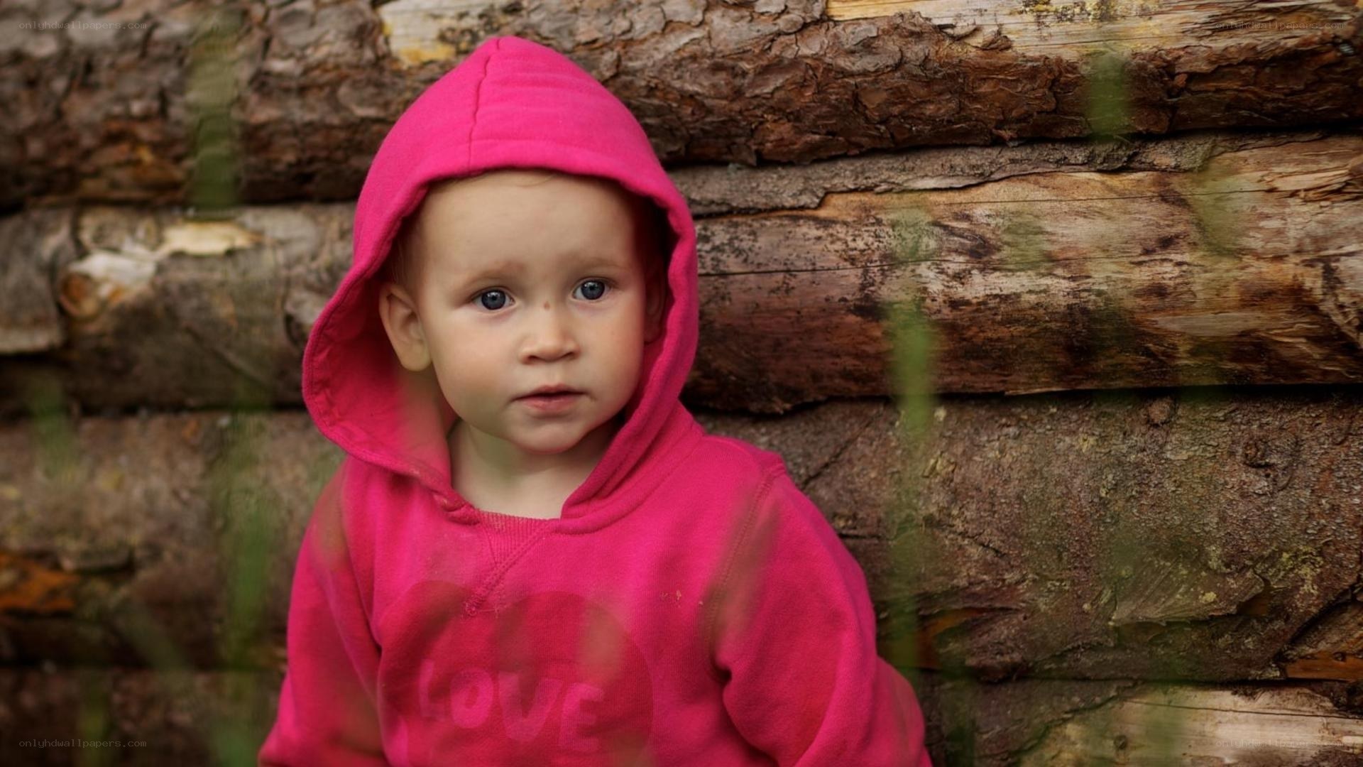 child in pink hoodie