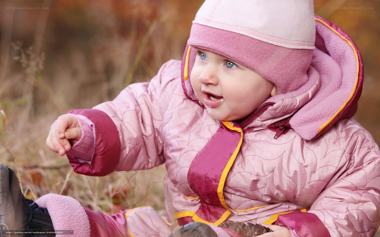 child in pink winter coat