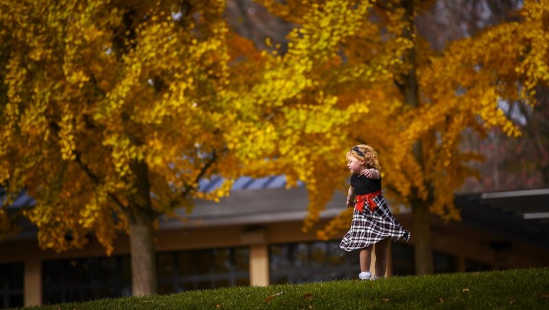Child in Plaid Skirt — Yellow