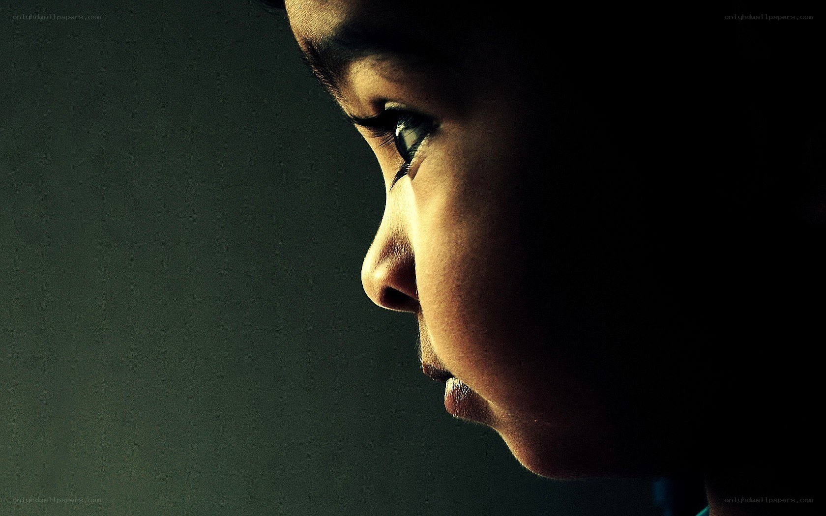 child in profile with dramatic lighting