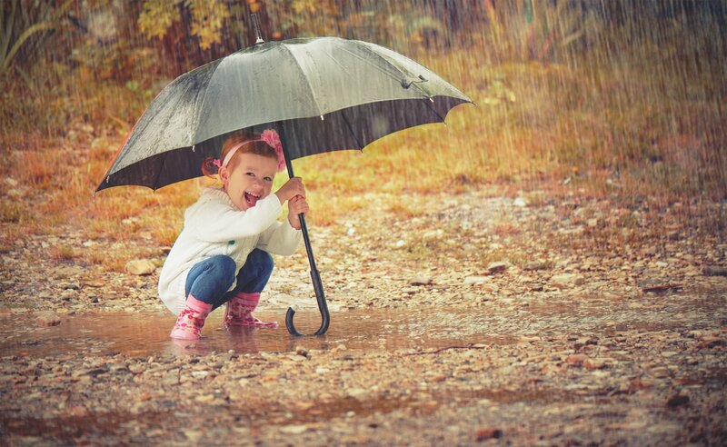 Child in Rain Boots — Brown