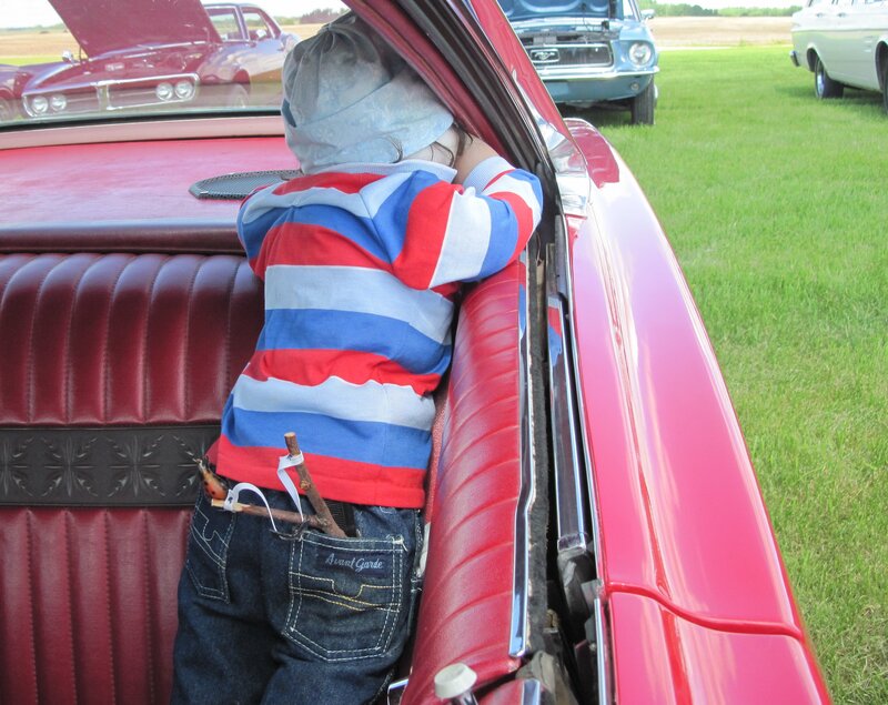 Child in Red Car