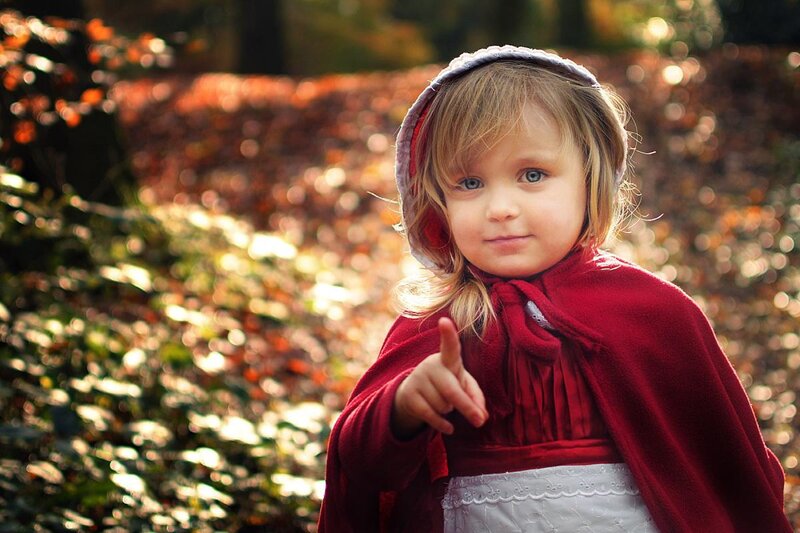 Child in Red Cloak — Playful
