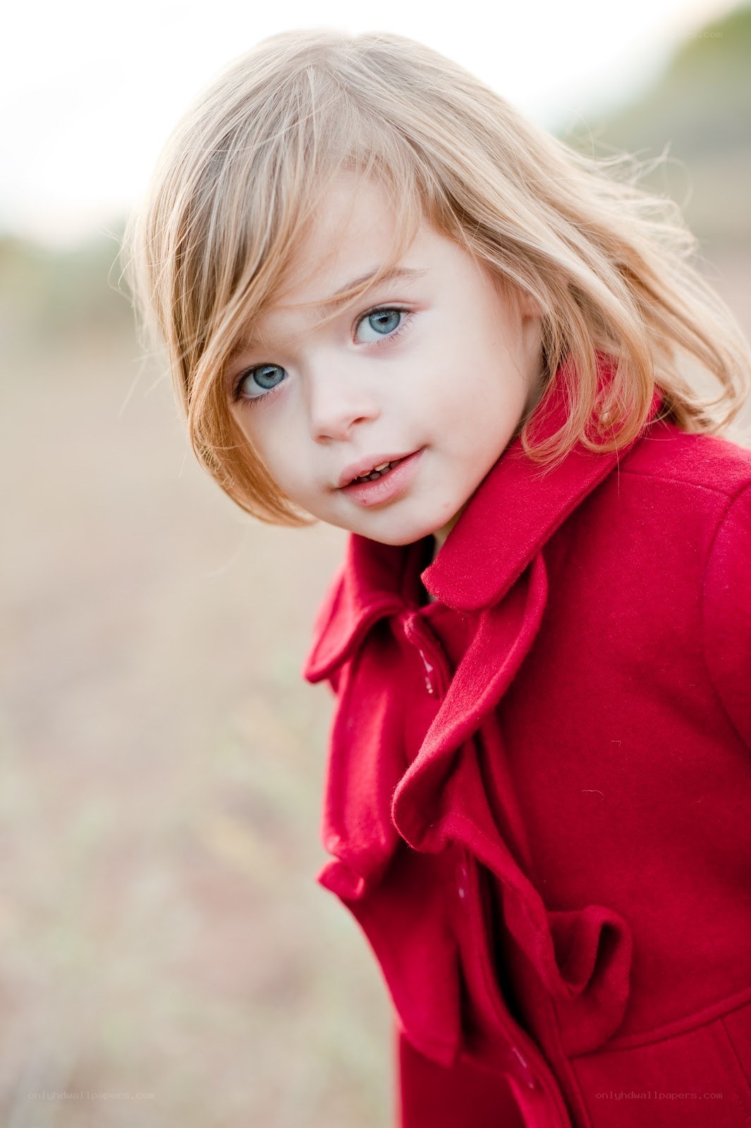child in red coat