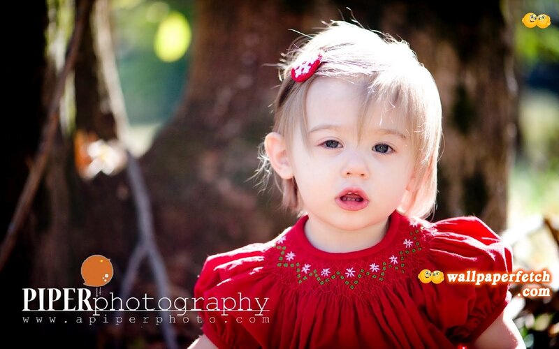 child in red dress outdoors