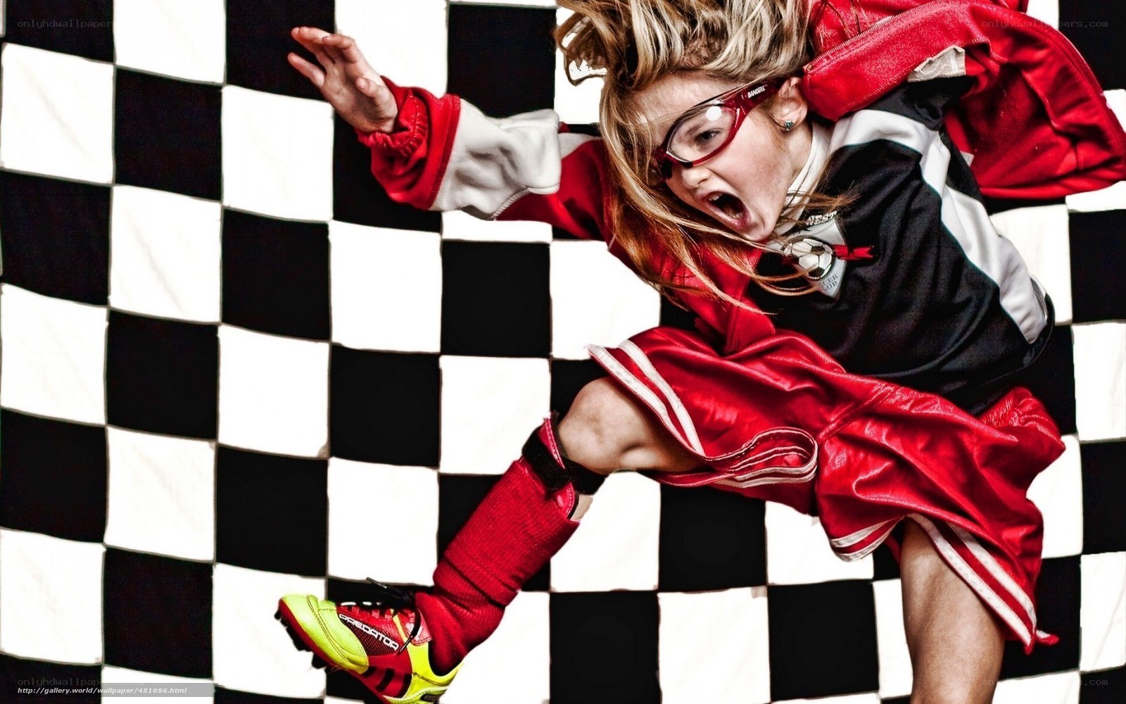 child in red jacket kicking