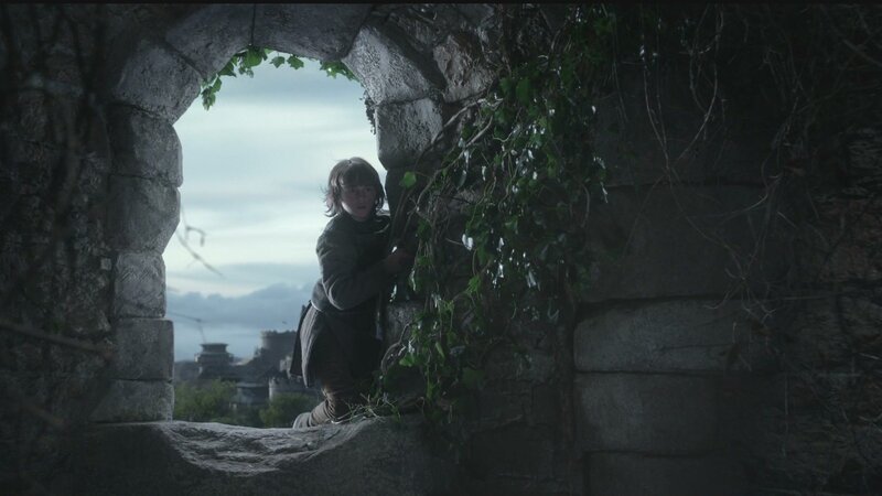 child in stone archway