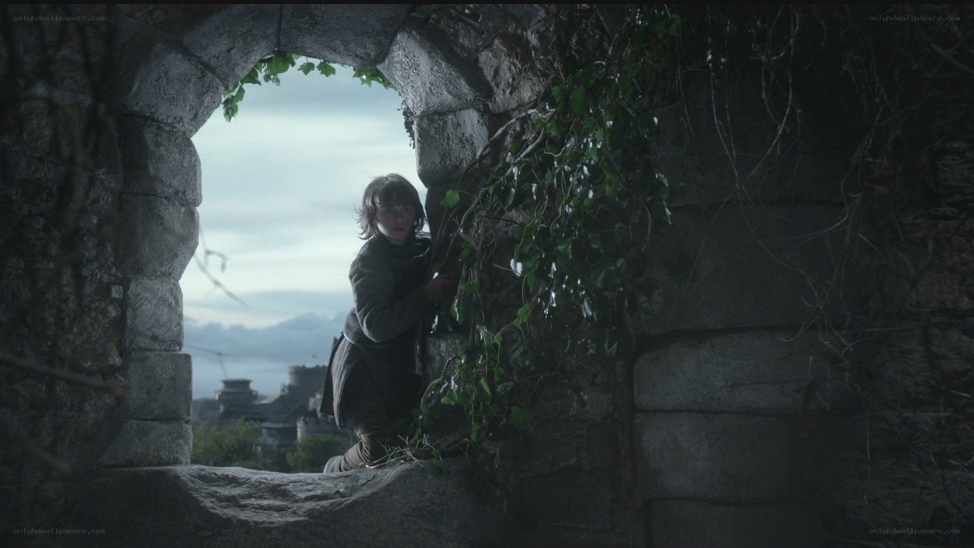 child in stone archway
