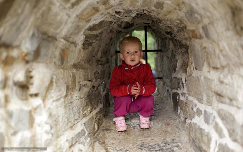 Child in Stone Tunnel — Red, Curious