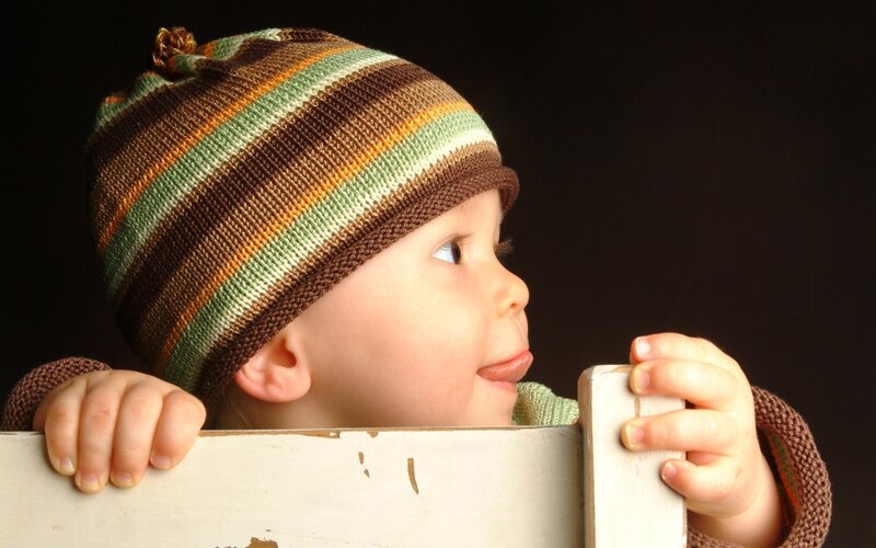 child in striped hat