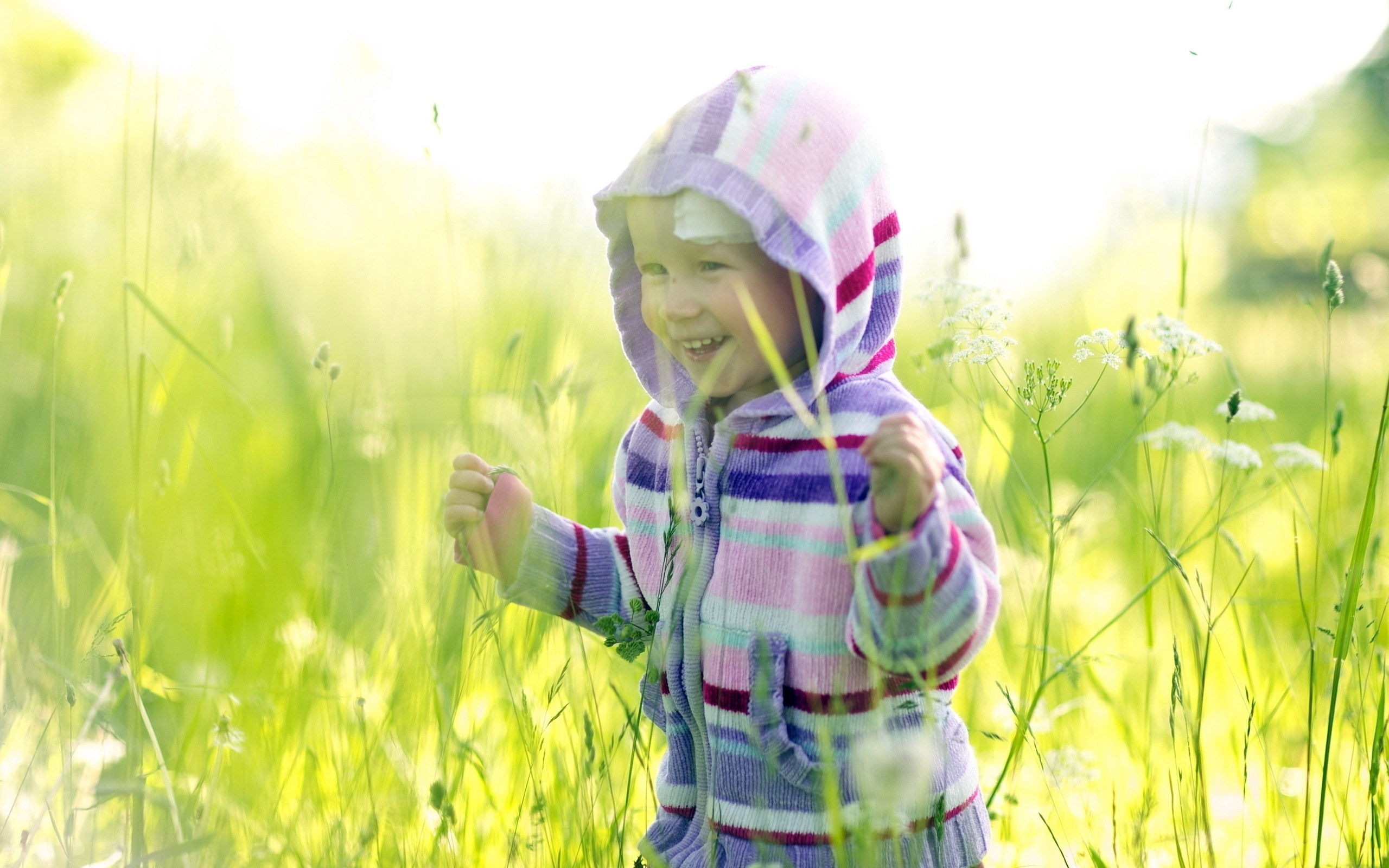 child in striped hoodie
