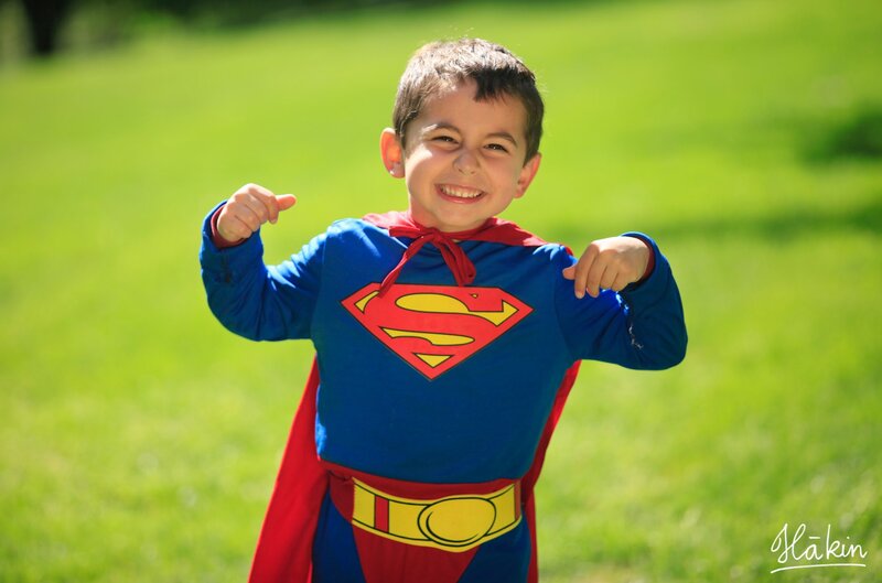 child in superman costume