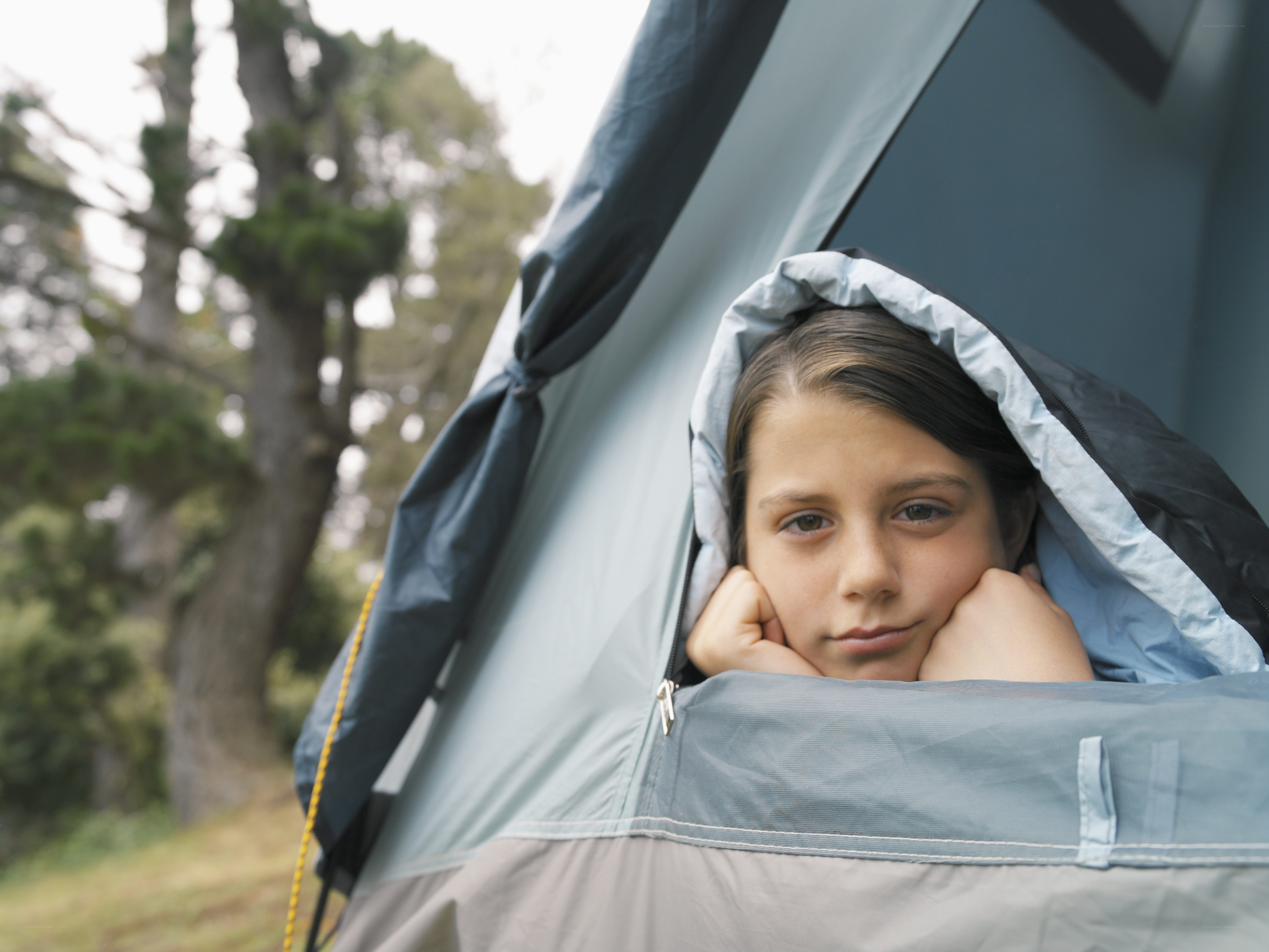 child in tent at campsite