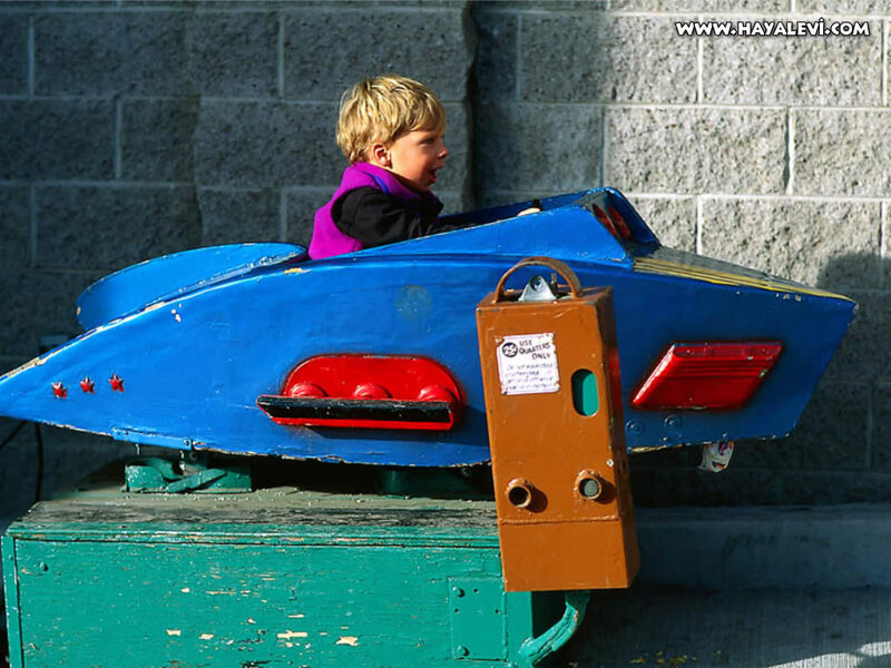 Child in Toy Car — Blue