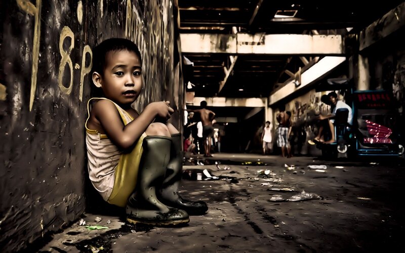 Child in urban alleyway