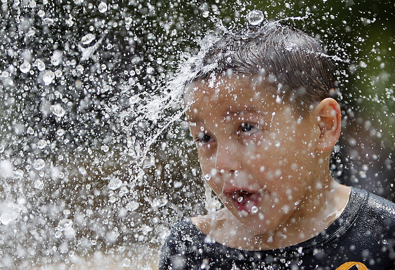 Child in Water Spray